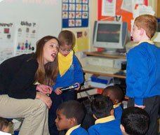 Image of teacher working with pupils